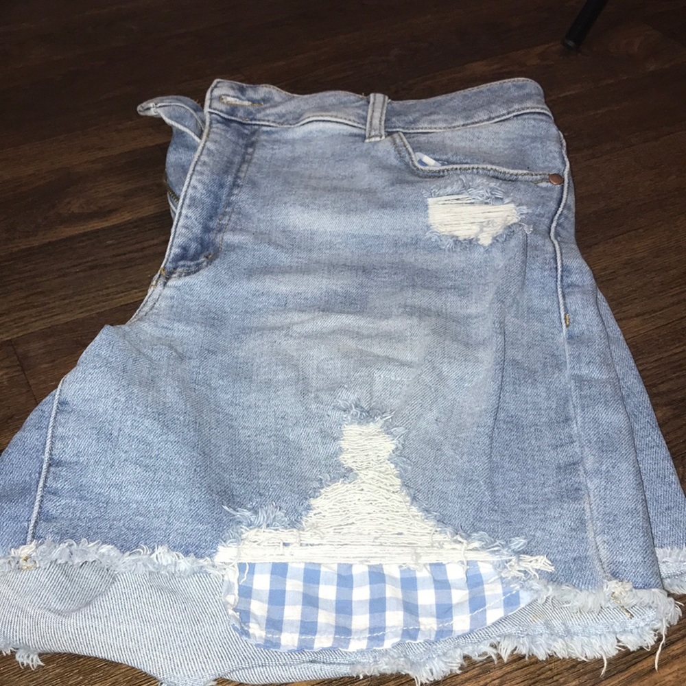Ripped blue jean shorts